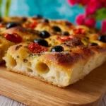 Deliziosa Focaccia Barese con pomodorini freschi e olio d'oliva