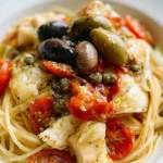 Piatto di Spaghettini con Baccalà, Olive, Capperi e Pomodorini