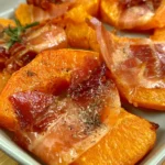 Delicious oven-baked pumpkin with speck, a quick main dish recipe.