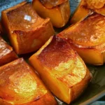 Delicious and sweet roasted pumpkin slices garnished with herbs