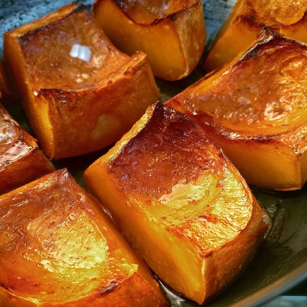 Delicious and sweet roasted pumpkin slices garnished with herbs