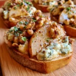 Bruschette con pere, gorgonzola e noci, un antipasto gustoso e raffinato.
